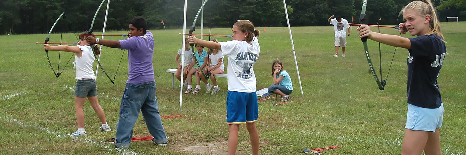 photo of kids with archery equipment