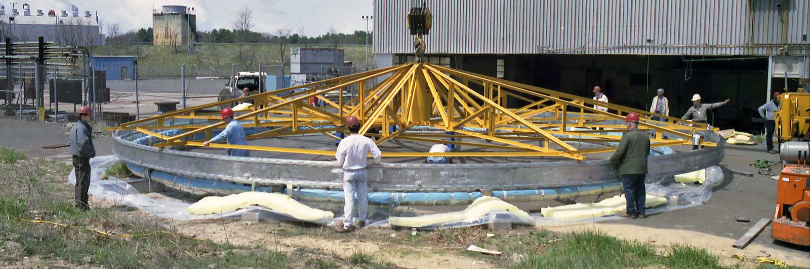 Photo of muon g-2 storage ring being installed, 1992