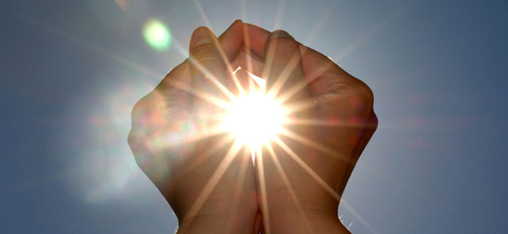 Photo of hands in the sun