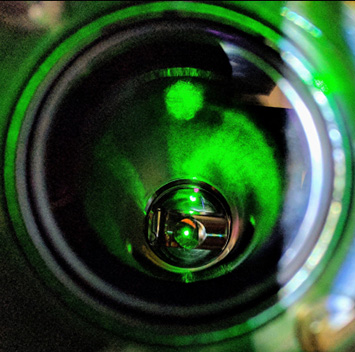 Small circular view of green laser