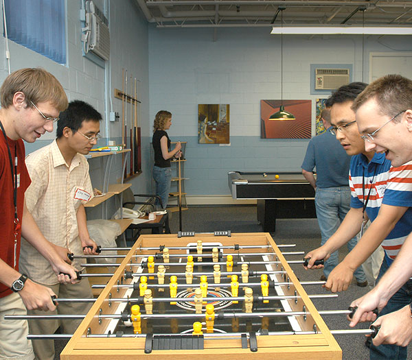 photo of people using foosball table