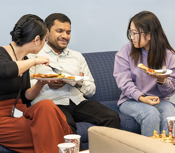 photo of people eating pizza