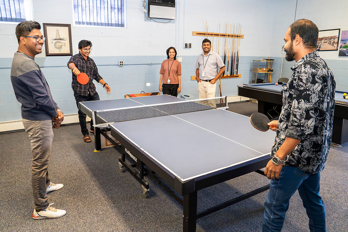 photo of people playing table tennis