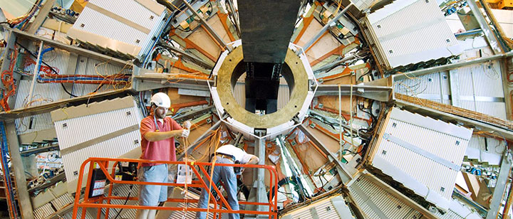 scientists install cathode strip chambers