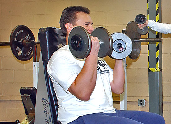 photo of man doing weight curls