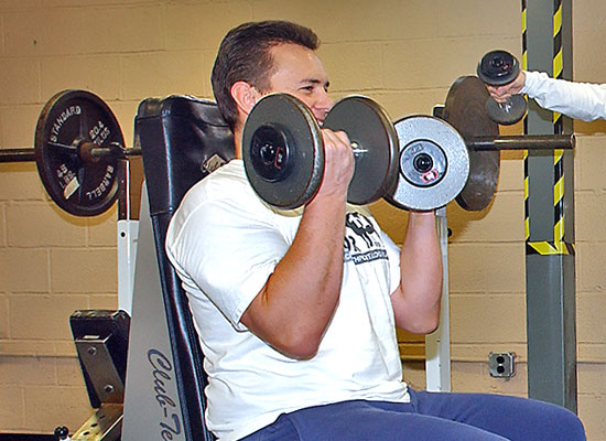 photo of man doing weight curls