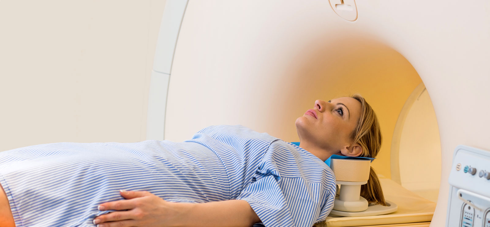 photo of woman entering an MRI machine