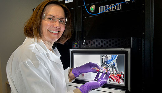 photo of researcher with machinery