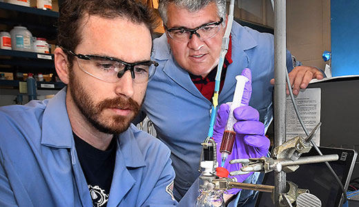 photo of researchers with syringe
