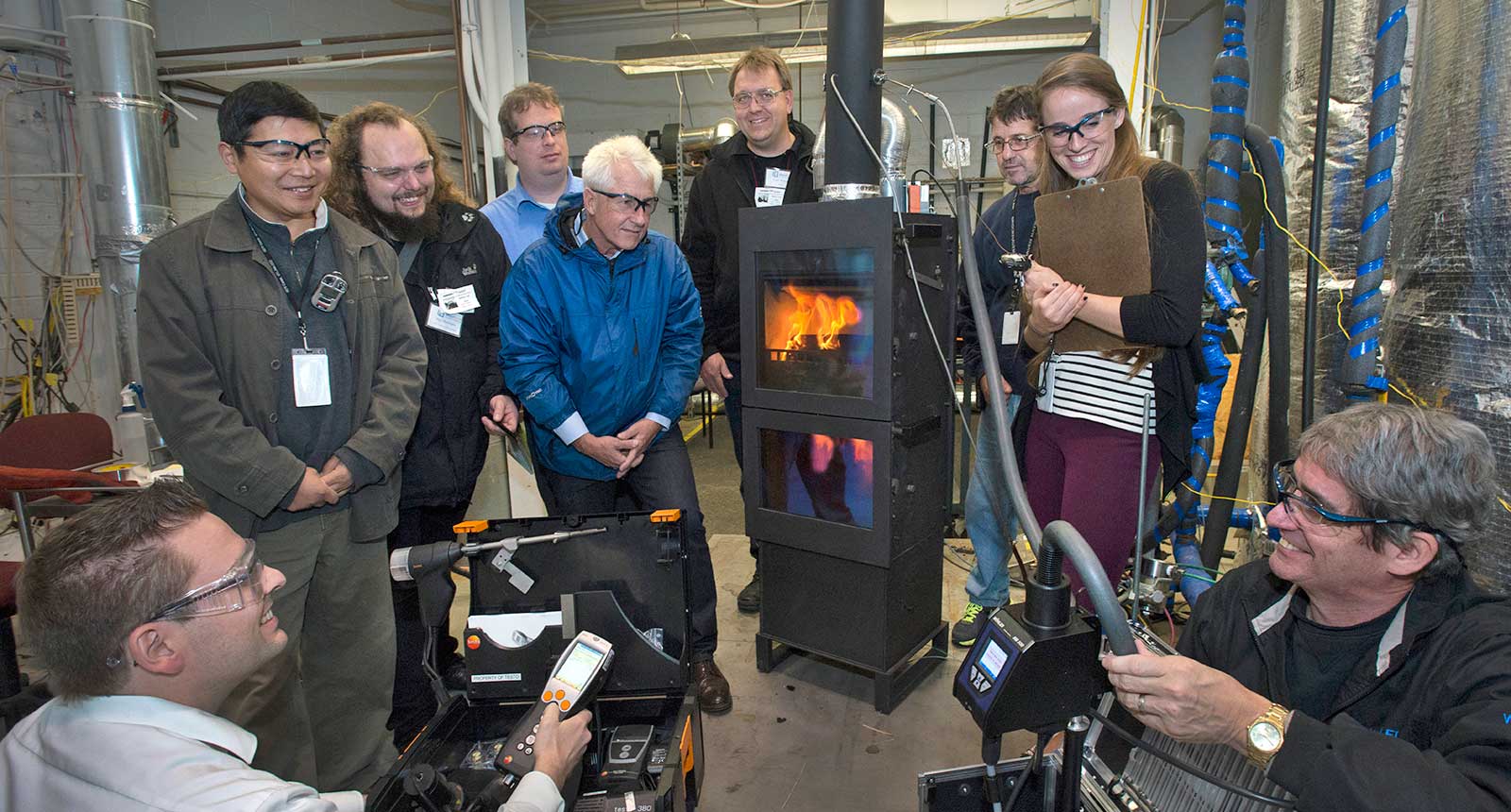 photo of people watching a stove heat combustion test