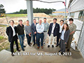 August 2013: John with the Beamline Advisory Team for the SIX project at NSLS-II. The preparations for the external building for SIX can be seen in the background.