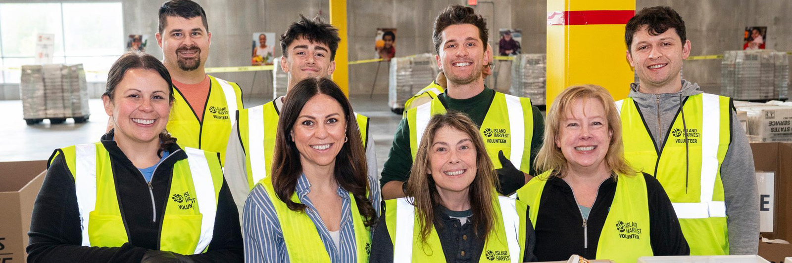 photo of people wearing reflective vests at a food pantry boxing event