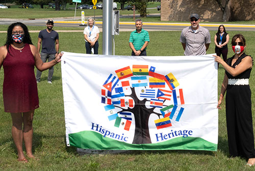 photo of HHG members with flag