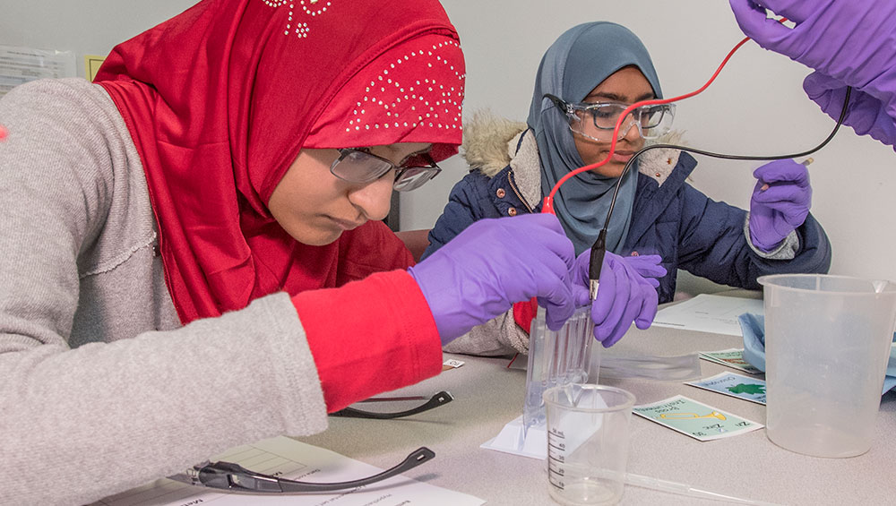 image of students in battery building lab