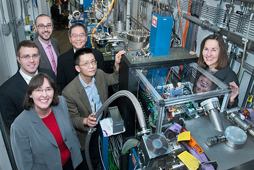 photo of people standing around a beamline end station