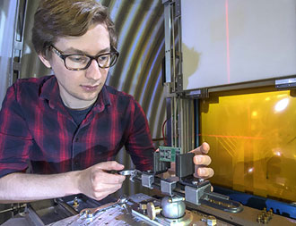 photo of researcher at Brookhaven's NASA space radiation laboratory
