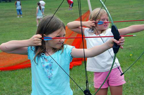 photo of girls with archery equipment