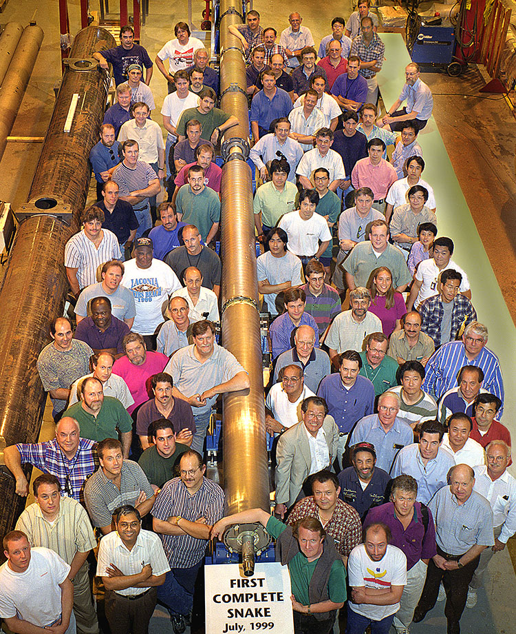 A technician adjusts magnet