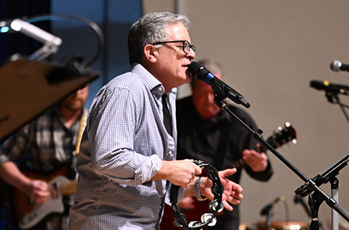photo of man singing on stage
