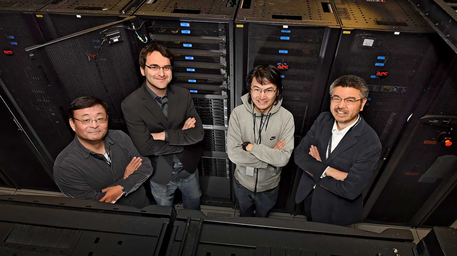 photo of g-2 researchers Chulwoo Jung, Christoph Lehner, Luchang Jin, and Taku Izubuchi