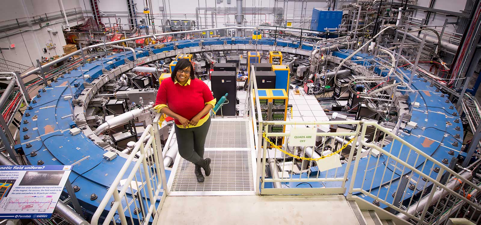 photo of woman in front of muon storage ring