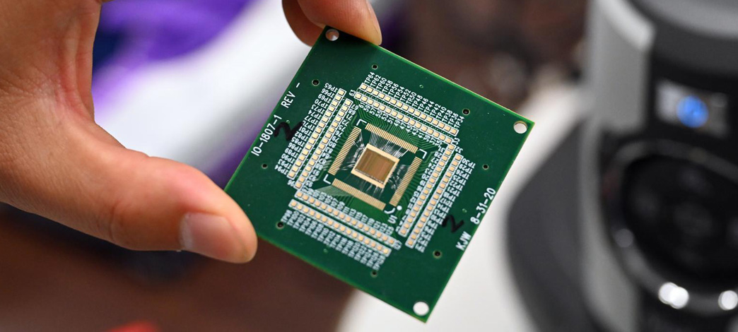 photo of a hand holding a circuit board