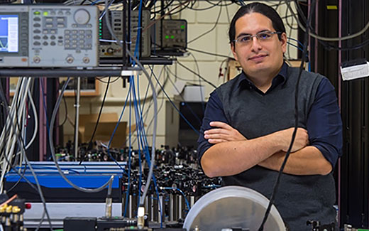 photo of quantum computing equipment with researcher