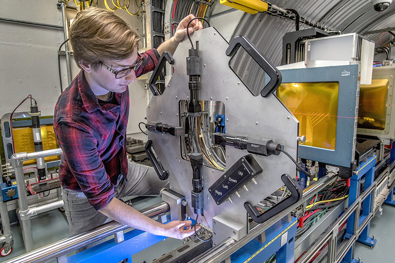 photo of person adjusting equipment