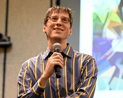 photo of man holding a microphone