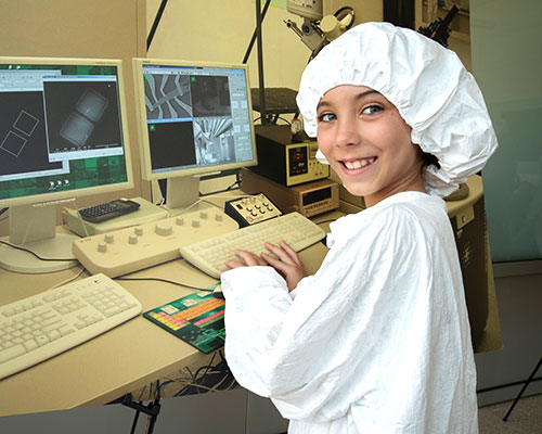 photo of girl in white tyvek lab suit
