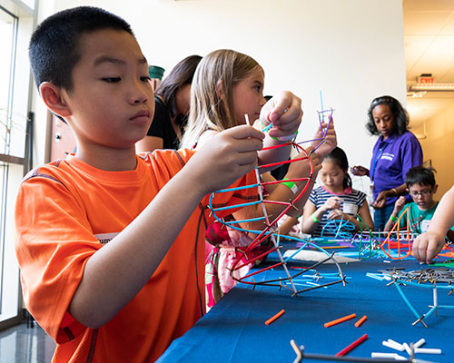 photo of kids assembling DNA models