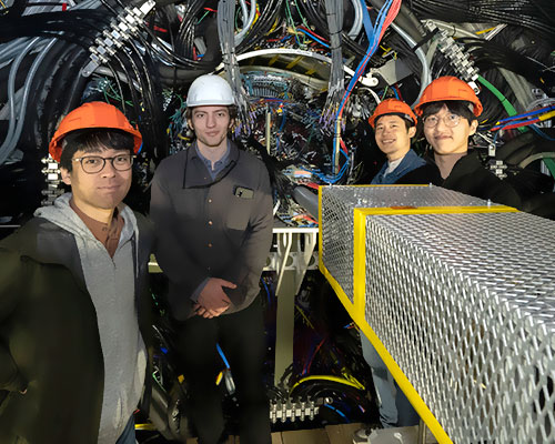 photo of people in front of the sphenix detector