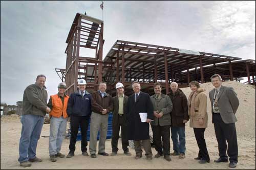 Picture of group of people celebrating "Top-Off" milestone at Brookhaven Labs Center for F
