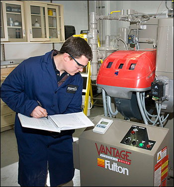 Chris Brown recording the boiler’s operating conditions