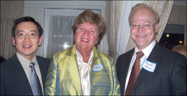 Yonggang Cui (left) and Ralph James with The Village Times Herald publisher Leah Dunaief