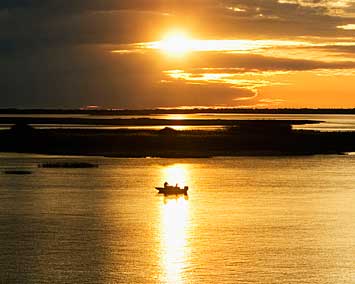 Small Boat in a Big Bay