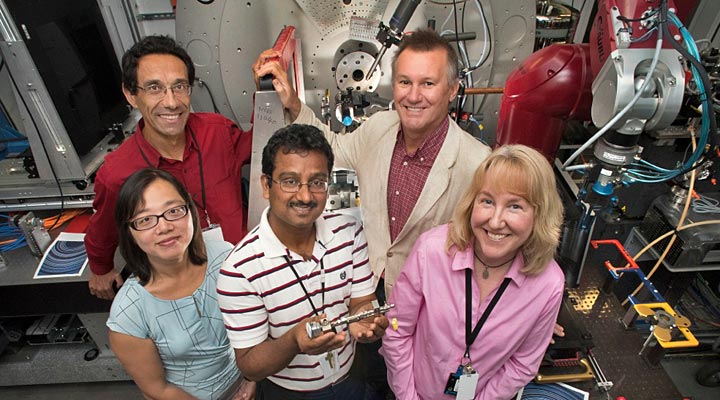 Sanjit Ghose, center, with colleagues