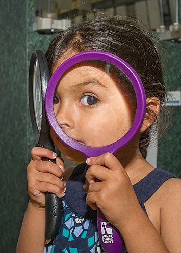 Summer Sundays image - girl with magnifying glasses