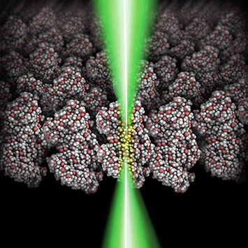 schematic of a focused electron beam shining through a polymeric film