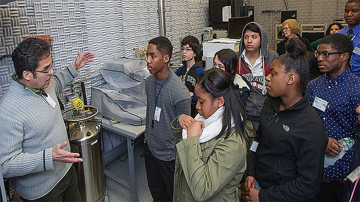 Dr. Camino giving a tour to a group of high school student