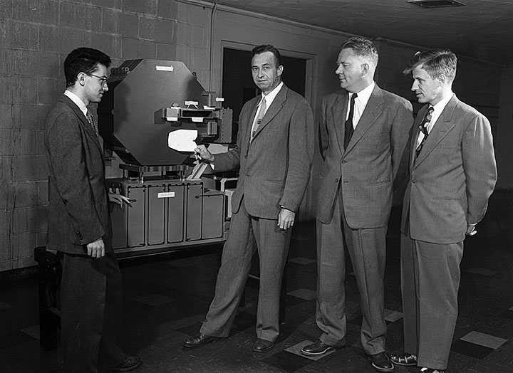 Ernest Courant with Stanley Livingston, Hartland Snyder, John Paul Blewett