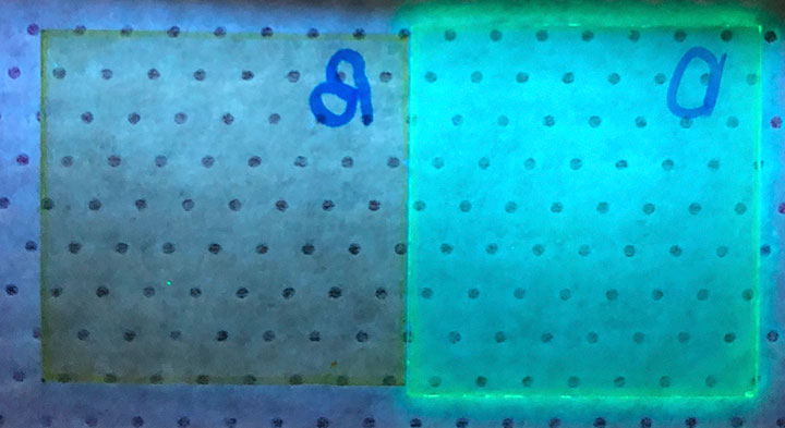 A photograph of the thin films under ultraviolet light exposure
