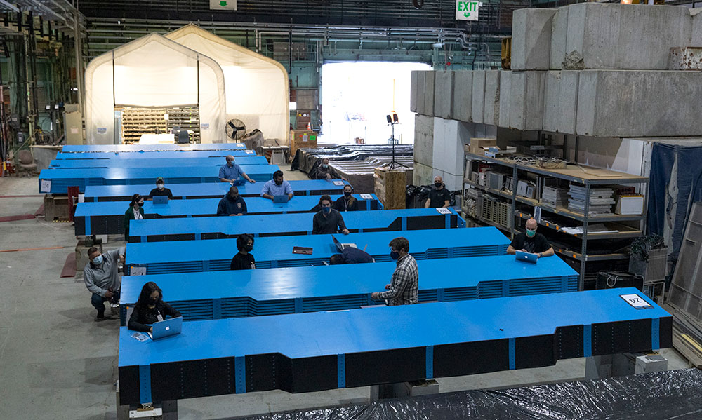 Photo of teams assembling sPHENIX outer hadronic calorimeter