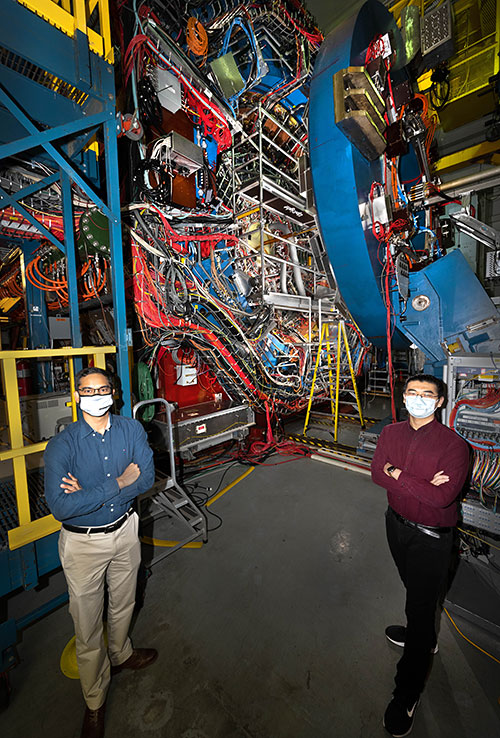Photo of Prithwish Tribedy (left) and Yu Hu Relativistic Heavy Ion Collider