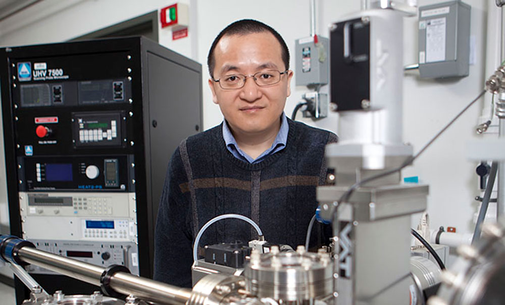 Photo of Guangwen Zhou in the Surface and Interface Laboratory at Binghamton University