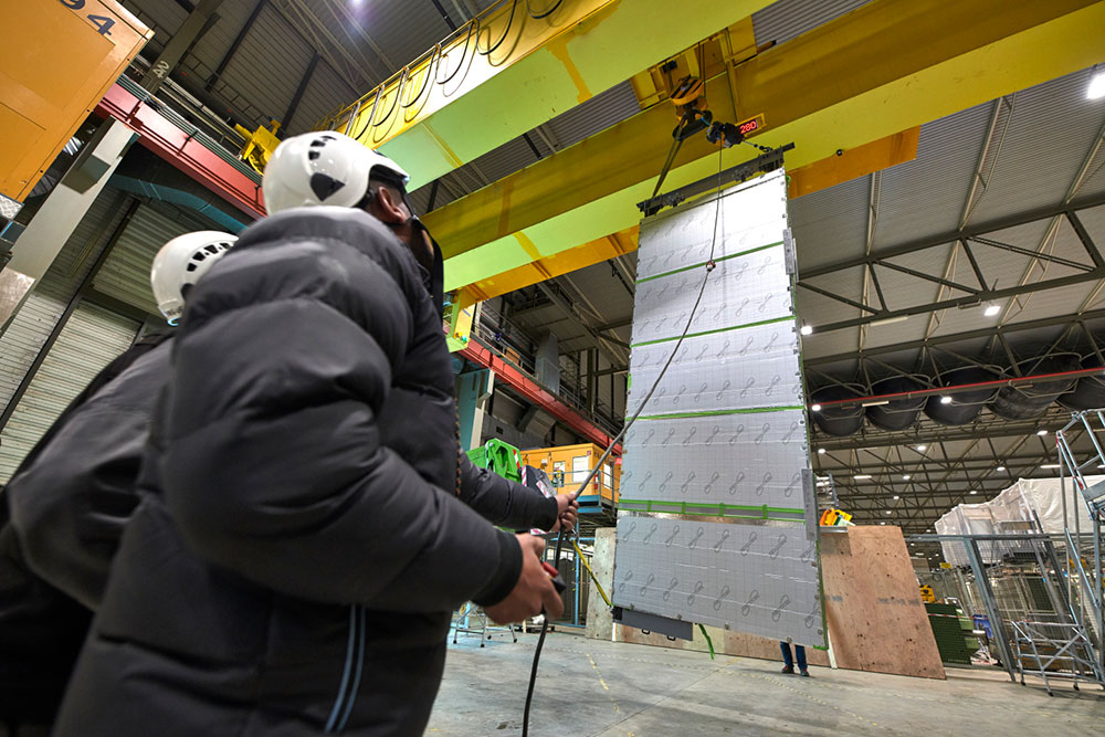 Photo of unpacking a particle detector device known as APA for testing at CERN