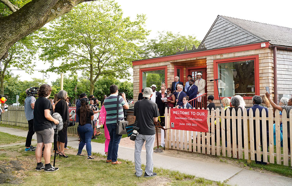 Photo of a crowd gathered outside of the Southampton African American Museum