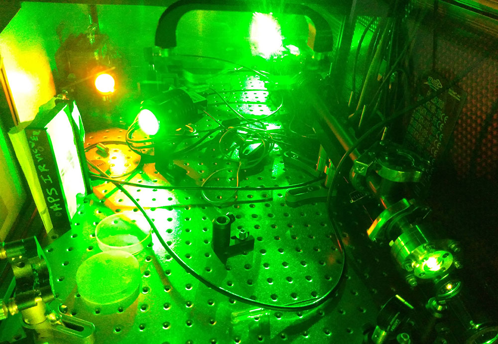 Photo of green iconic laser converting to orange laser