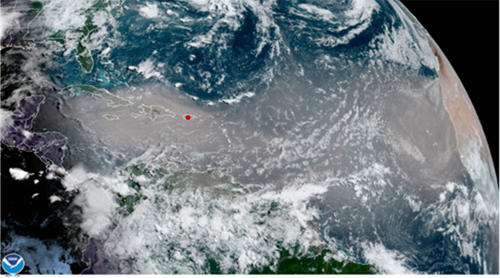 Satellite image showing large dust plume over the Caribbean