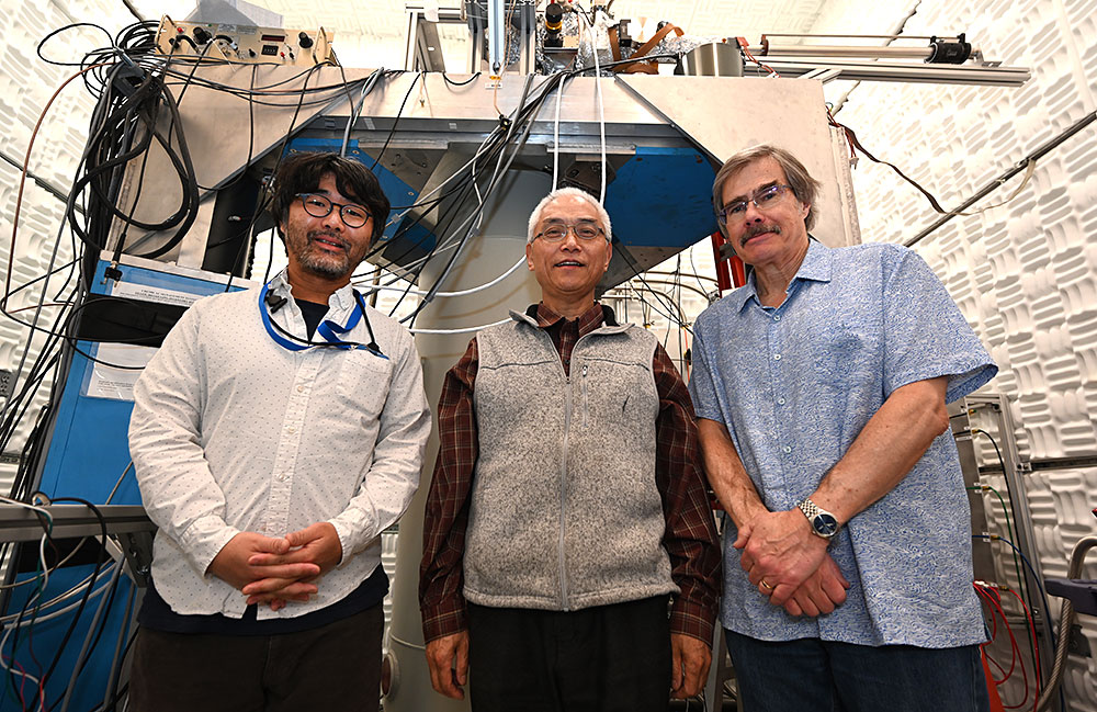 From left to right: Kazuhiro Fujita, Genda Gu, John Tranquada stand in front of the spectroscopic im